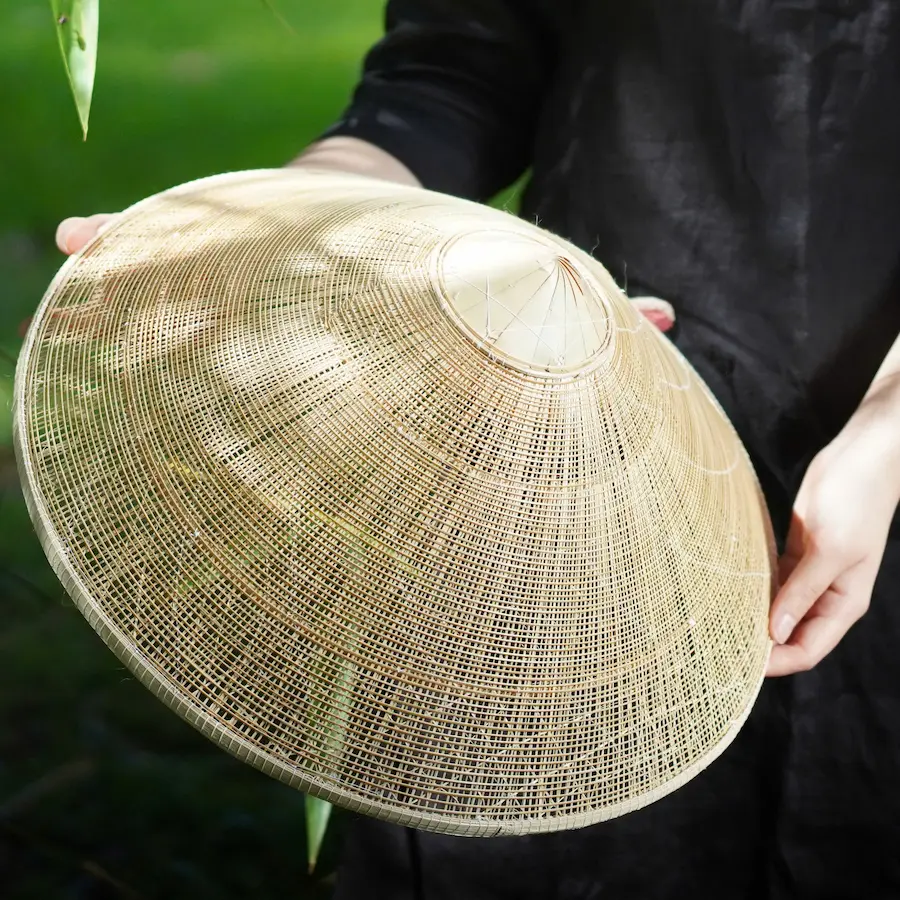 Top view of a plain 40cm conical hat (non la) showing its natural woven texture